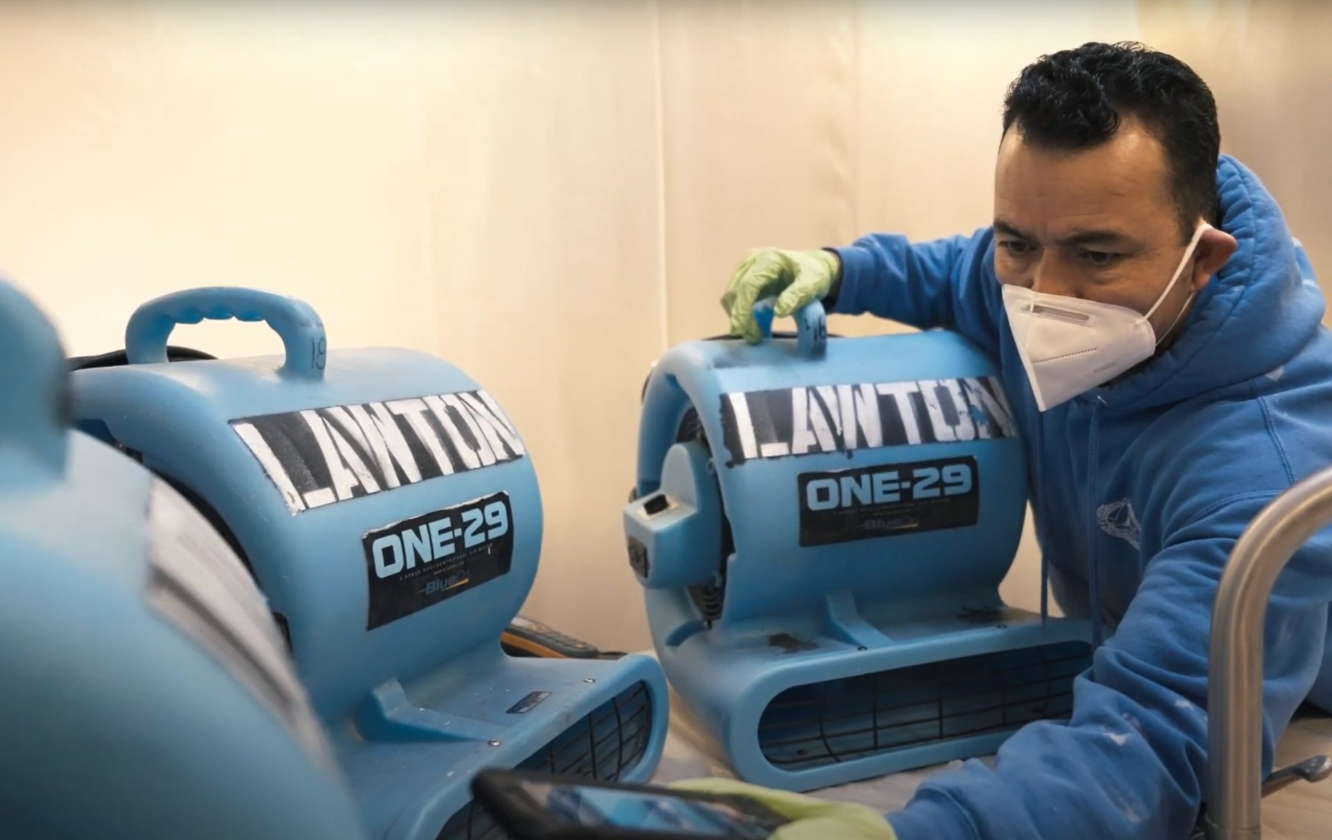 Emergency water damage restoration equipment in Katy, TX Professional water damage restoration technician using industrial drying equipment